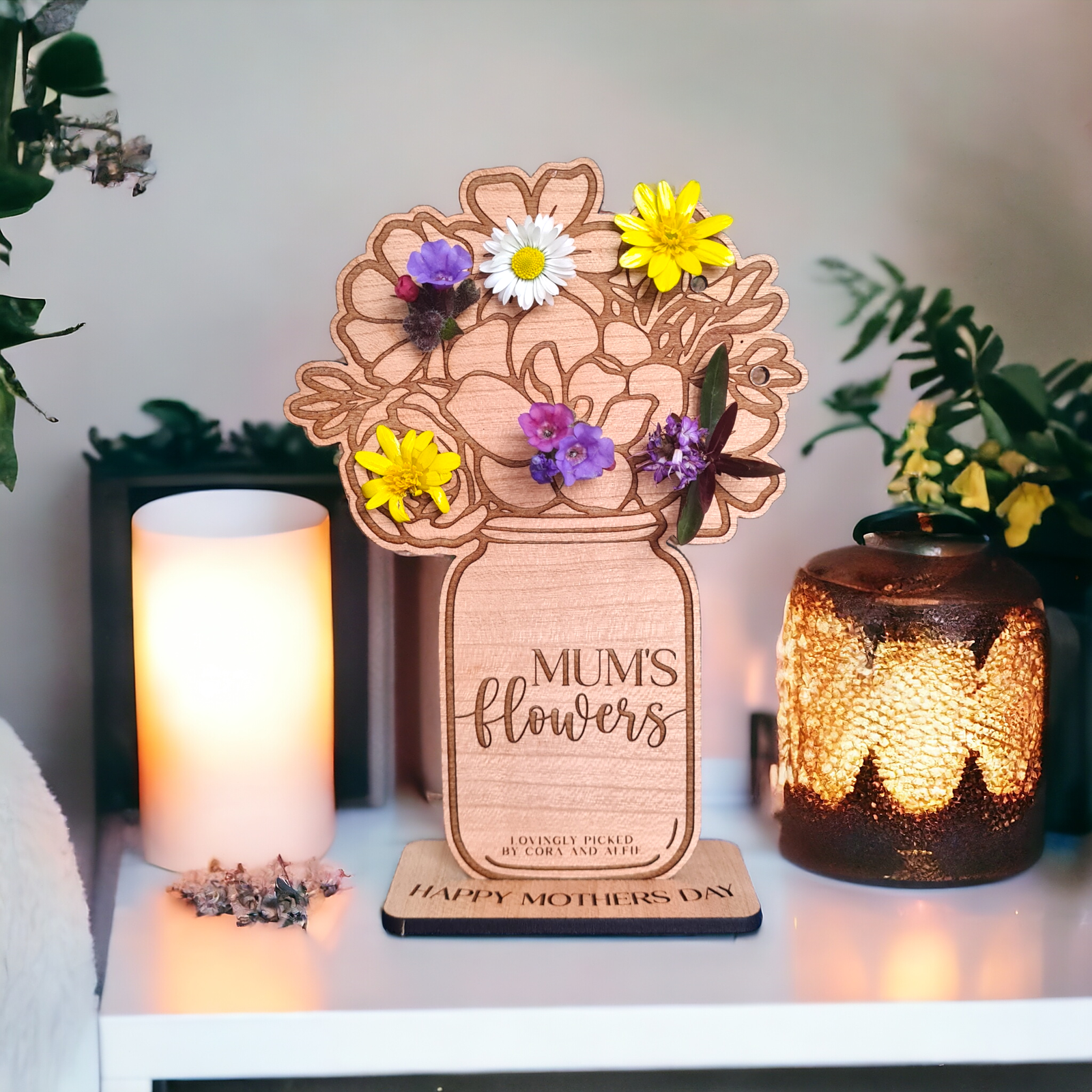 Personalized wooden 'Mum's Flowers' display, designed to hold real picked flowers. Crafted from high-quality wood, this beautiful keepsake features an engraved mason jar design with space for custom engraving. A heartfelt and reusable gift for Mother's Day, allowing children to showcase their handpicked flowers in a unique and sentimental way.